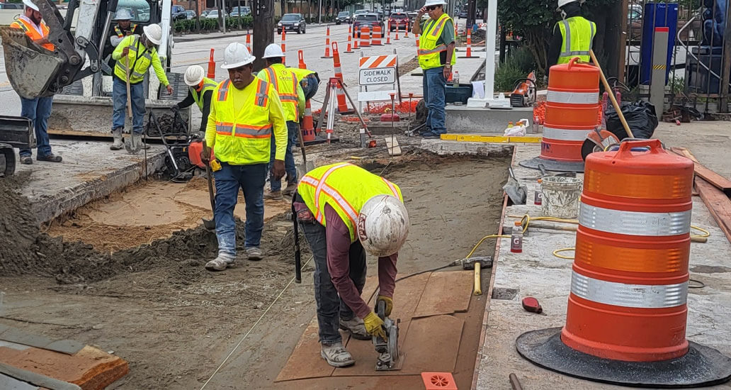 Placing cement sand and preparing area for concrete.