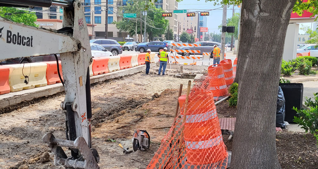 Construction workers prepare road area for the black asphalt base on the corner of Westheimer and Weslayne.
